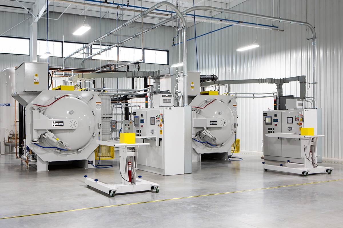 Two Ipsen TurboTreater vacuum furnaces with loaders